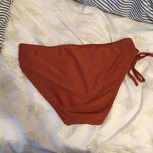 Orange bathing suit.